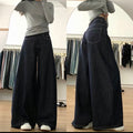 Person wearing wide-leg jeans in a clothing store.