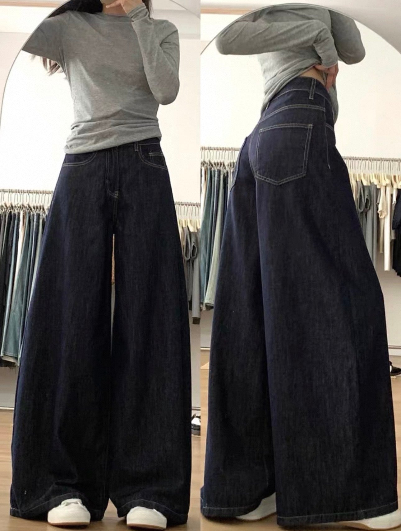 Person wearing a gray shirt and wide-leg jeans in a clothing store.