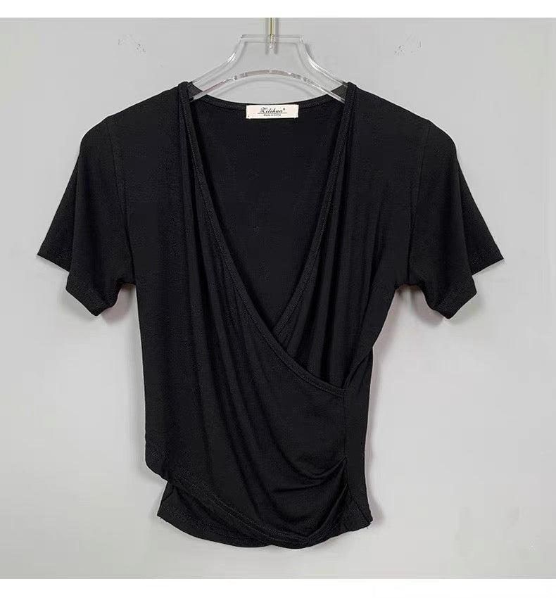Black draped t-shirt on a hanger against a white background