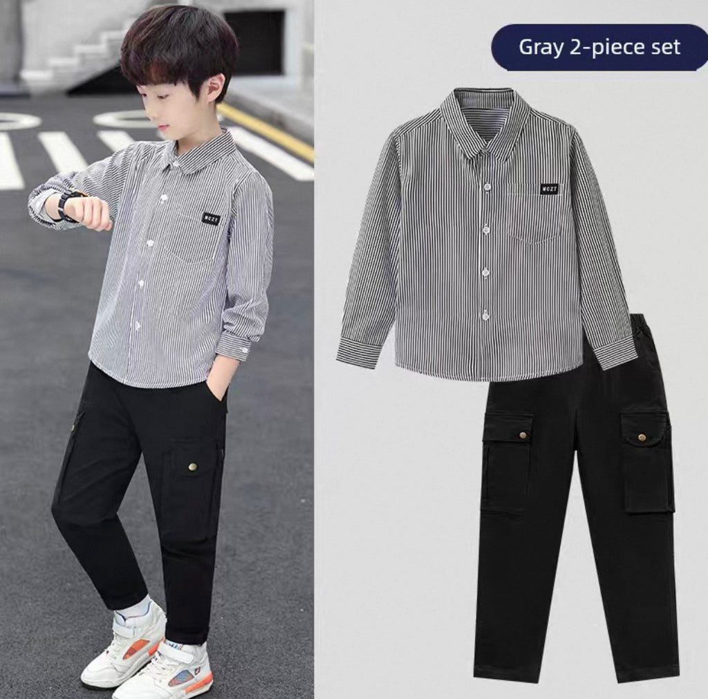 Gray striped shirt and black pants set with a child model on a road.
