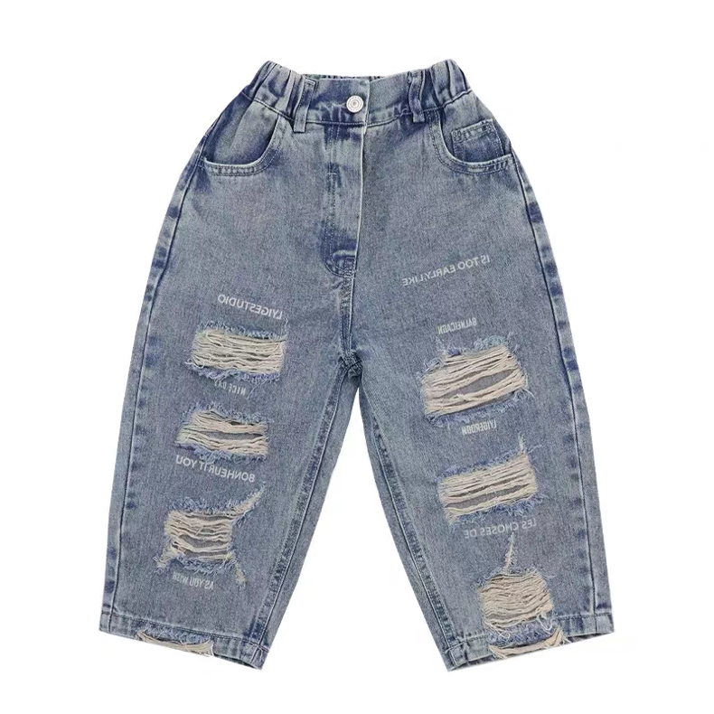 Distressed blue jeans on a white background
