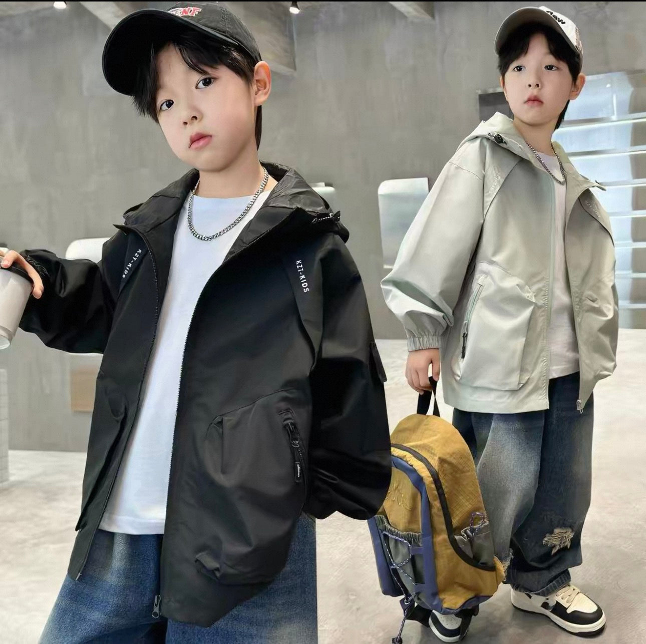 Two children wearing jackets in an indoor setting