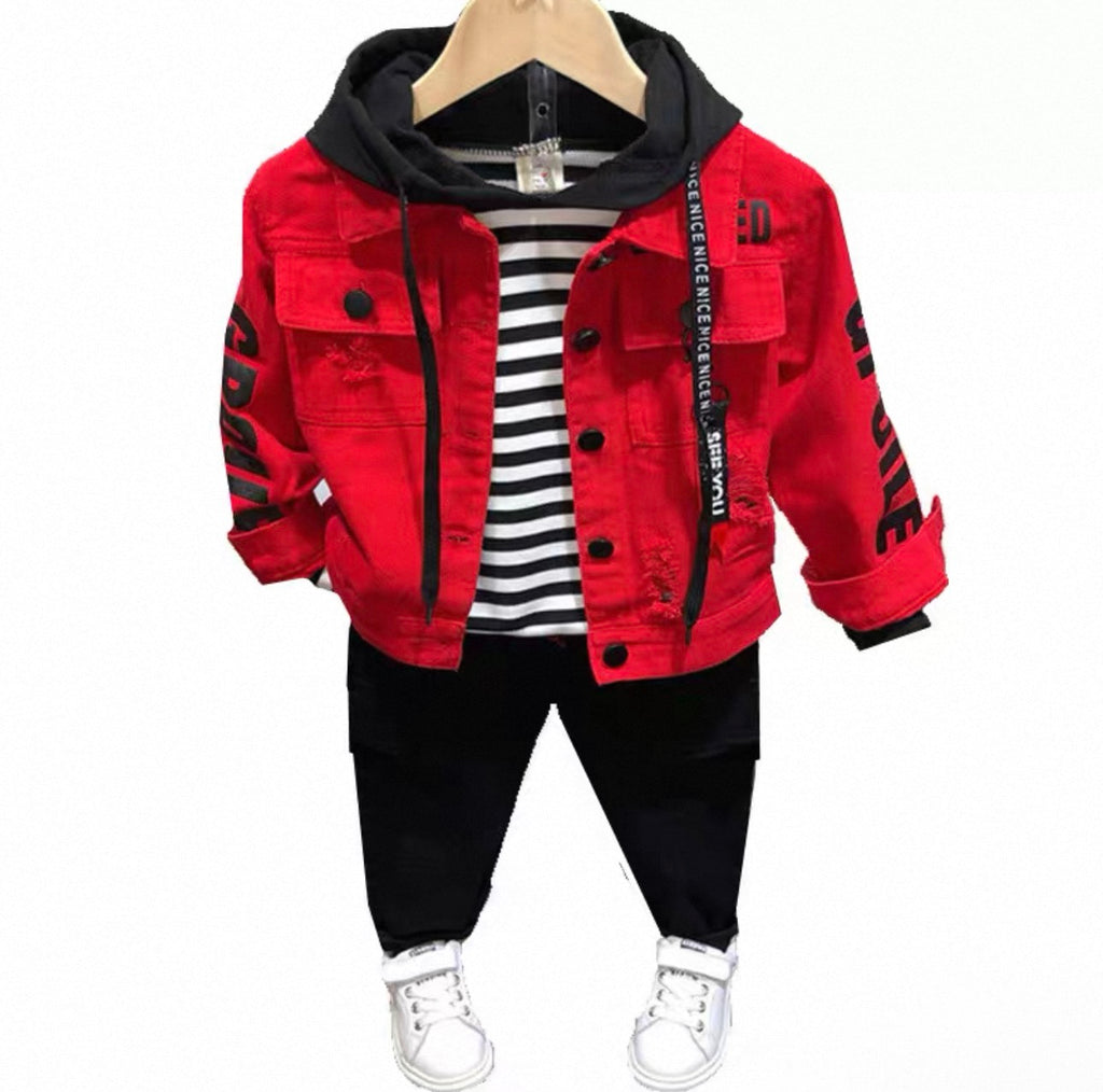 Red jacket with black accents, striped shirt, black pants, and white sneakers on a mannequin against a white background.