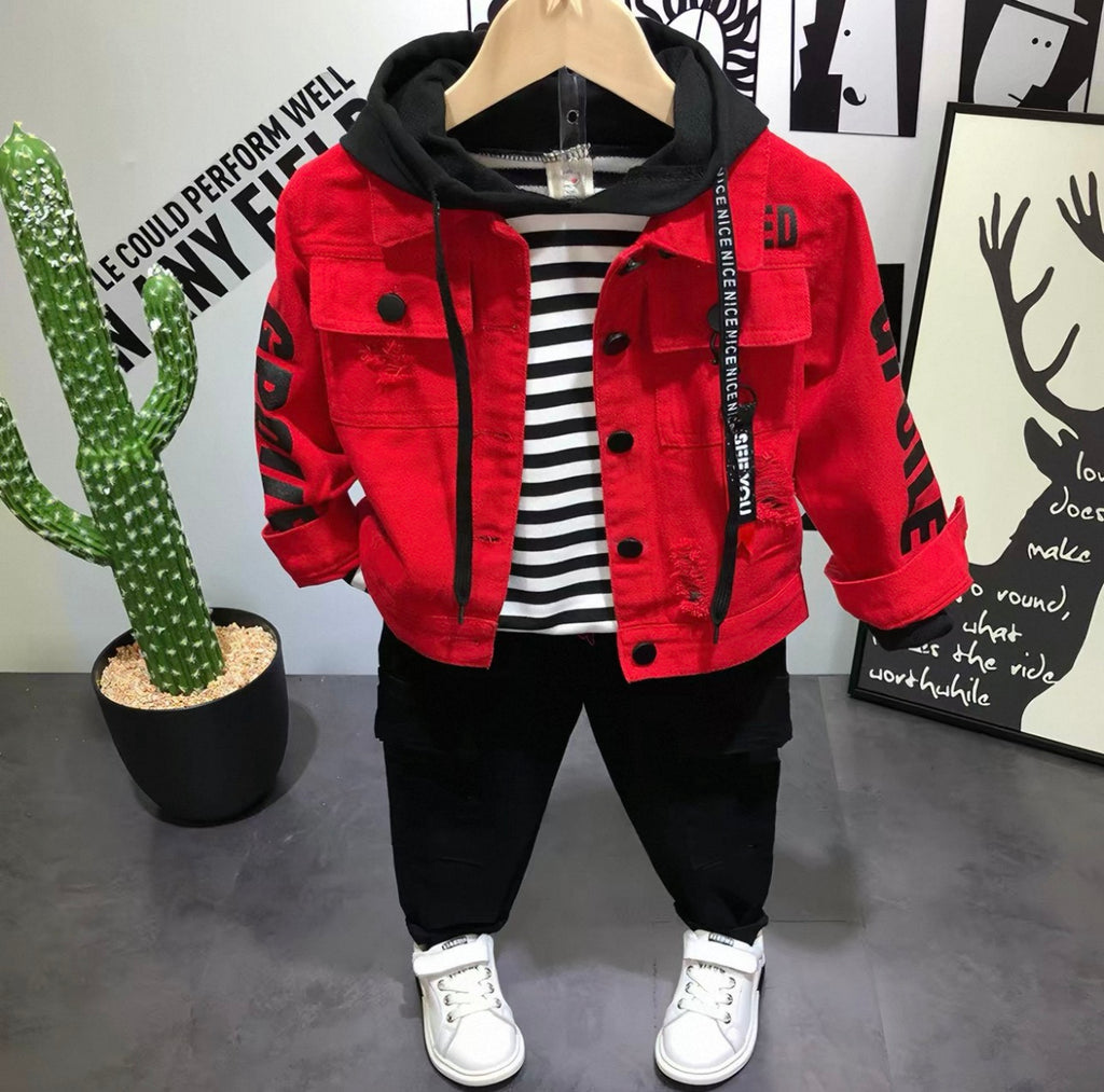 Red jacket with black accents on a hanger against a wall with artwork