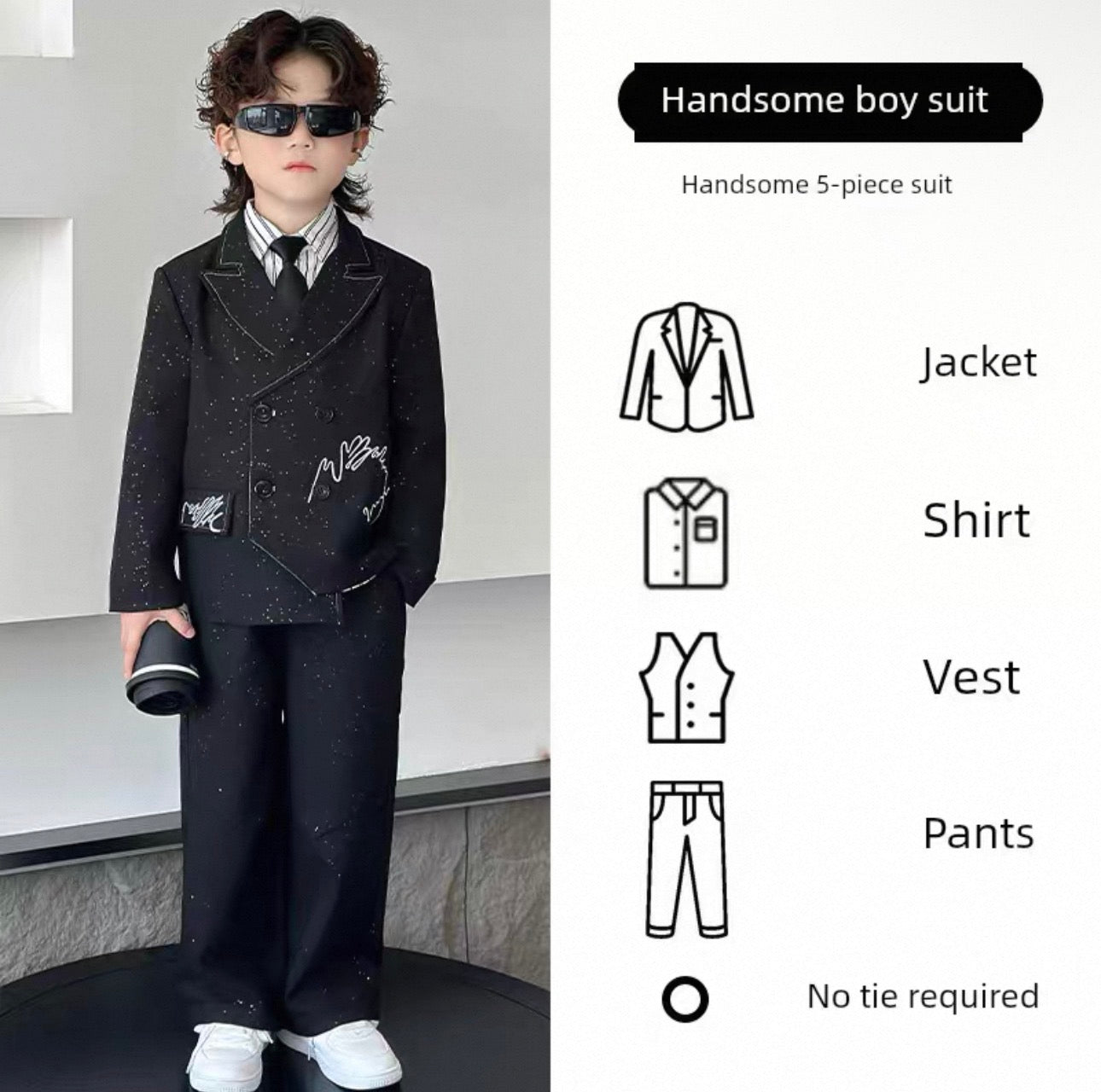 Child wearing a formal suit with sunglasses, standing against a neutral background.