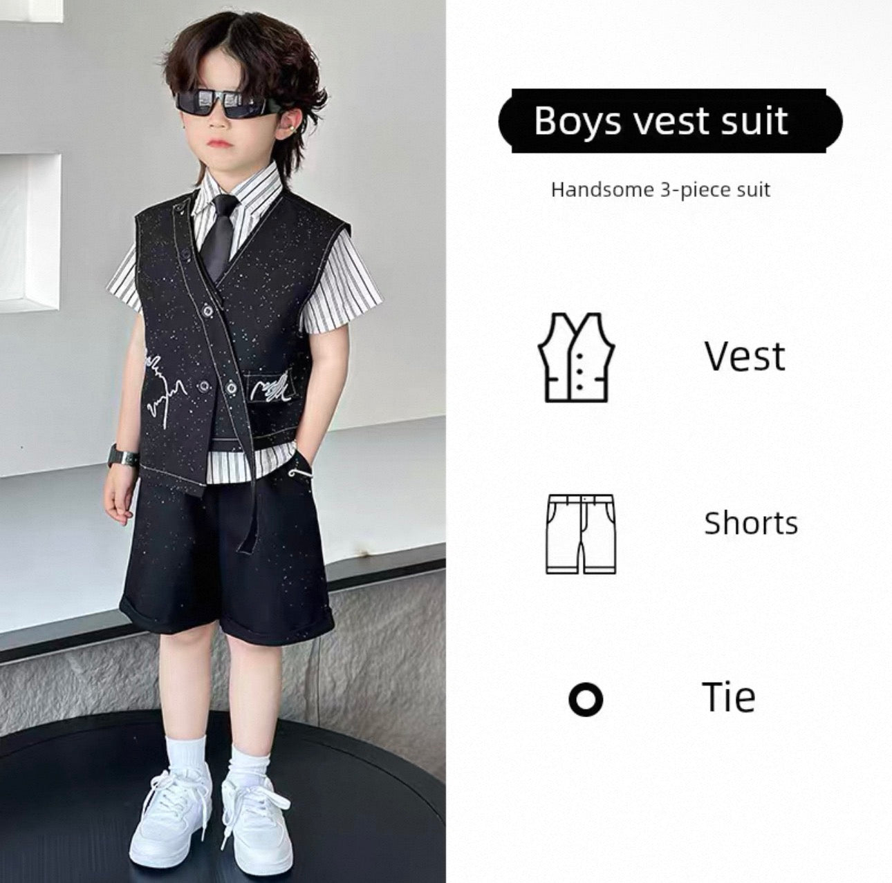 Child wearing a boys' vest suit with vest, shorts, and tie on a neutral background