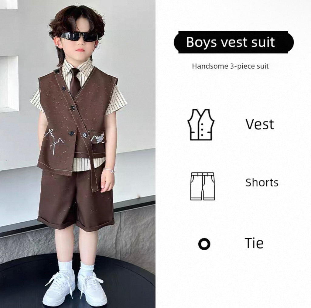 Child wearing a boys' vest suit with vest, shorts, and tie on a neutral background.