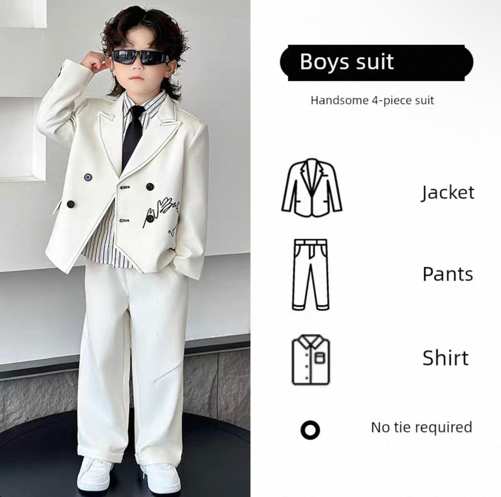Child wearing a white suit with sunglasses, labeled 'Boys suit' on a plain background.