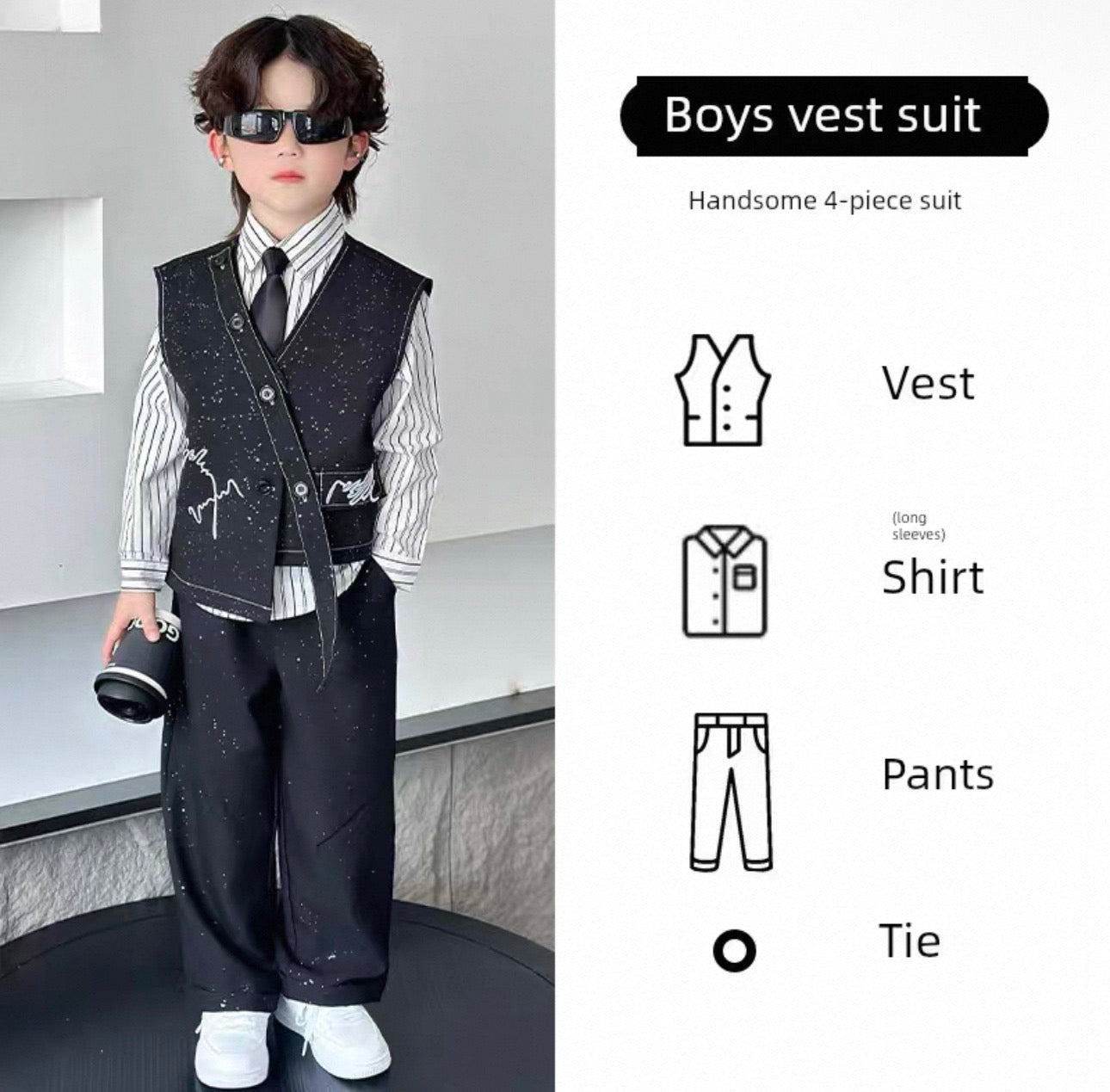 Child wearing a boys' vest suit with sunglasses, standing against a modern interior background.
