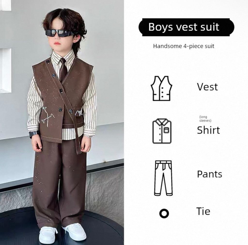 Child wearing a boys vest suit with a plain background