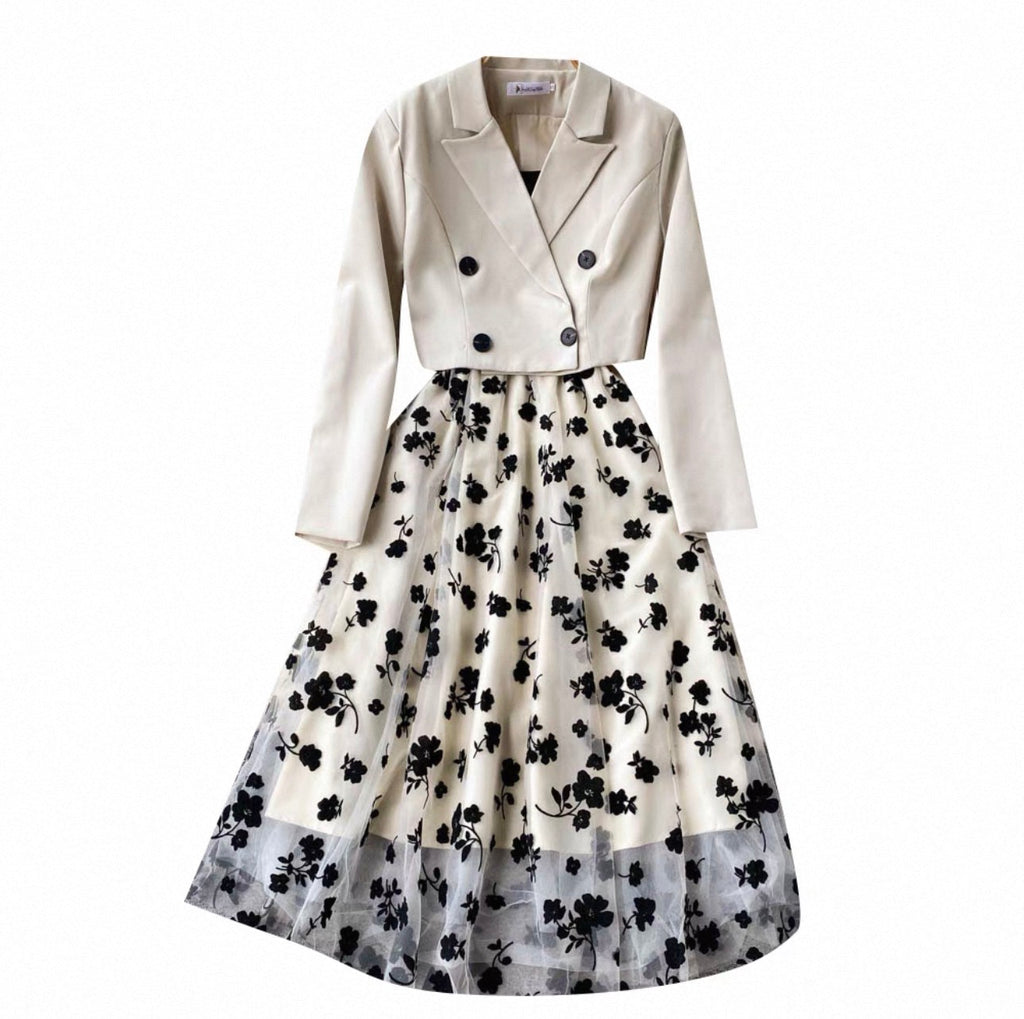 White blazer and floral skirt set on a white background