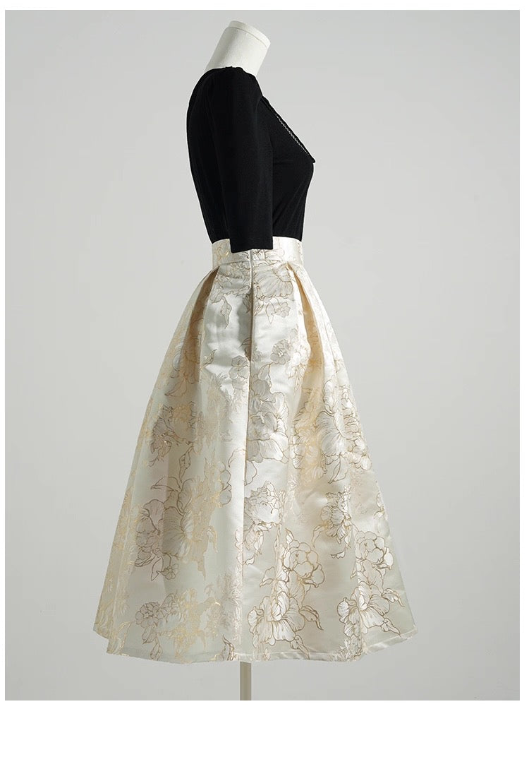 Mannequin wearing a black top and white lace skirt on a light gray background