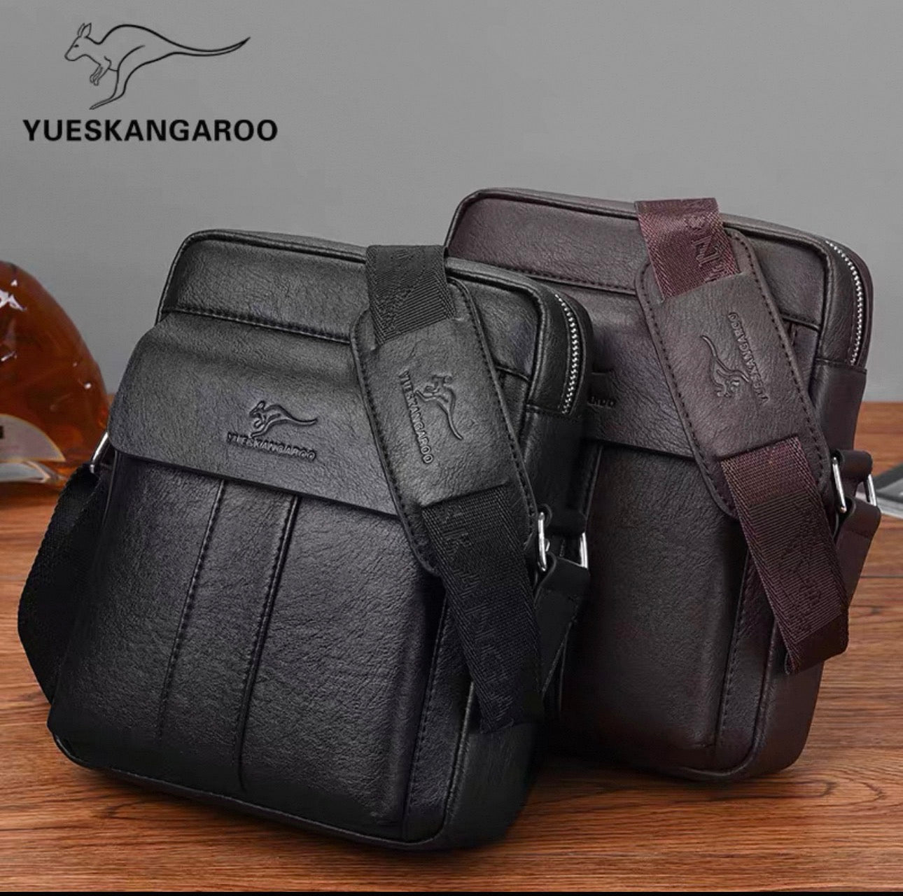 Two black leather bags with kangaroo logo on a wooden surface, featuring YUESKANGAROO brand.