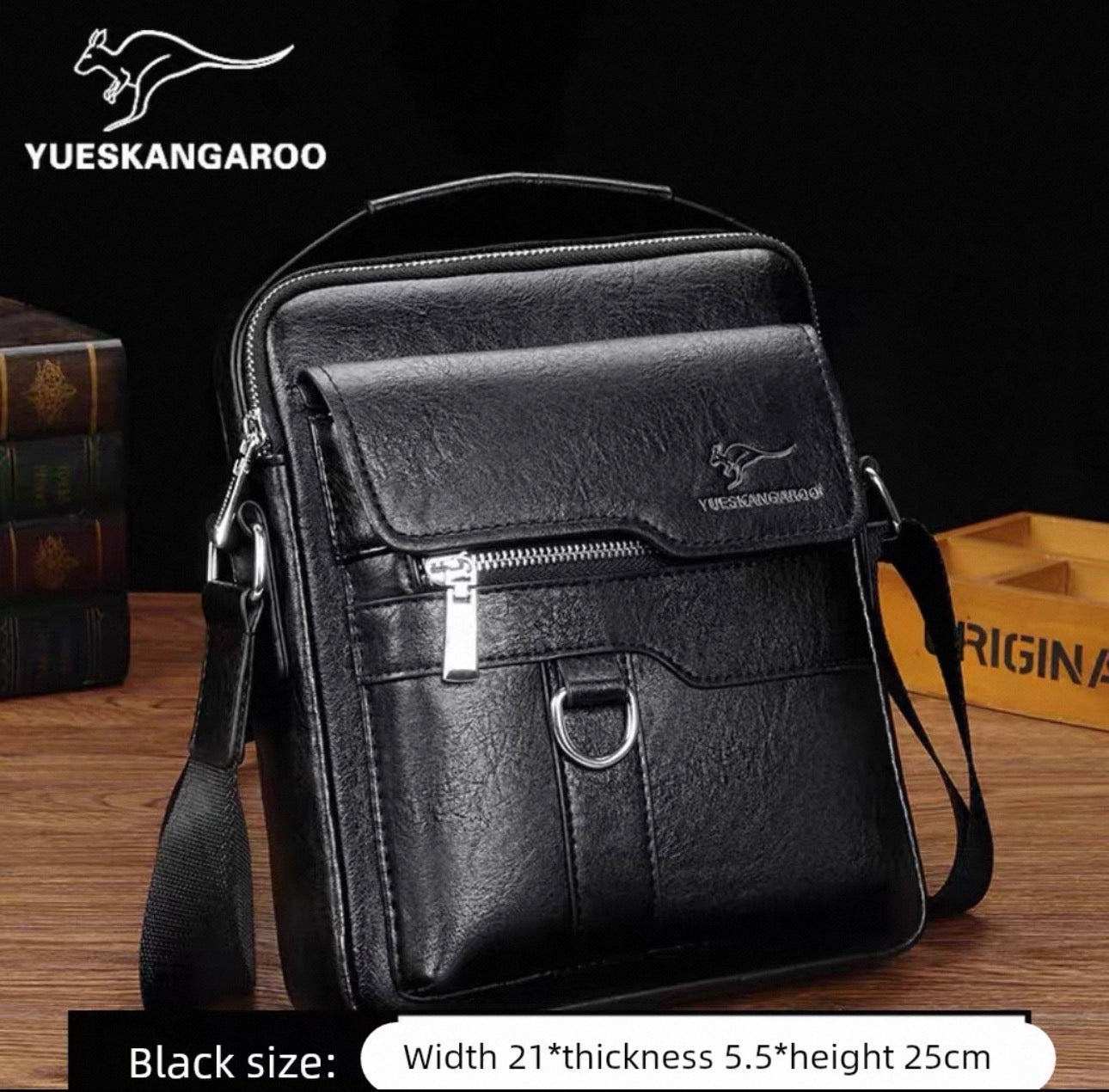 Black leather bag with YUESKANGAROO branding on a wooden surface.
