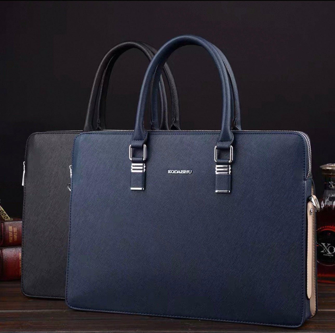 Blue leather briefcase with visible brand name on a dark background