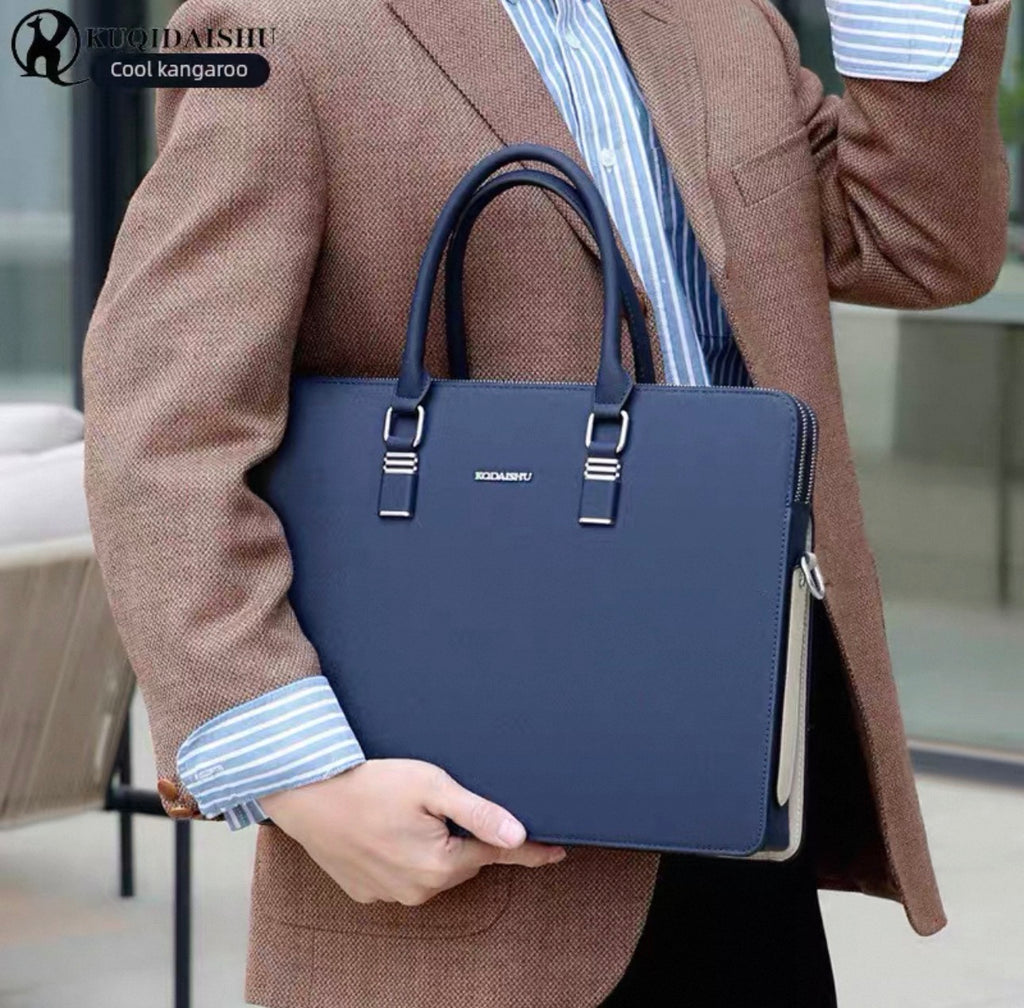 Person holding a blue handbag with 'HIDAISShu' branding, wearing a brown coat.