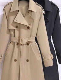Beige trench coat with a belt and buttons on a white background