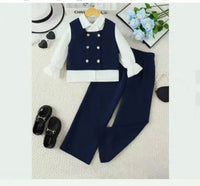 Children's navy vest and pants set with white shirt on a light gray background.