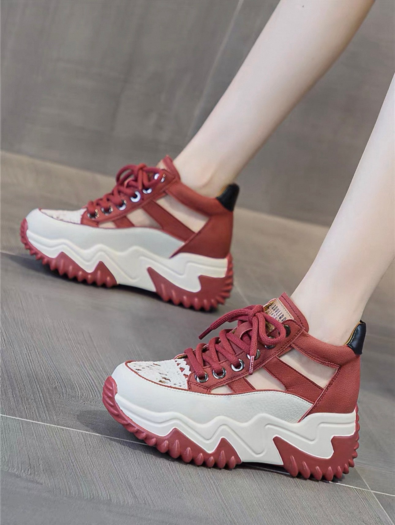 Red and white sneakers on a neutral background