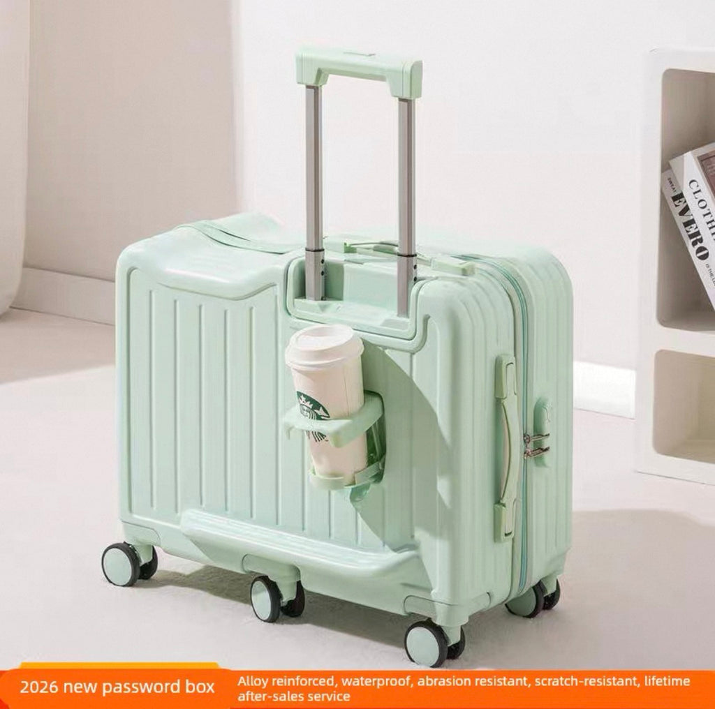 Mint green suitcase with a cup holder attached, on a light background.