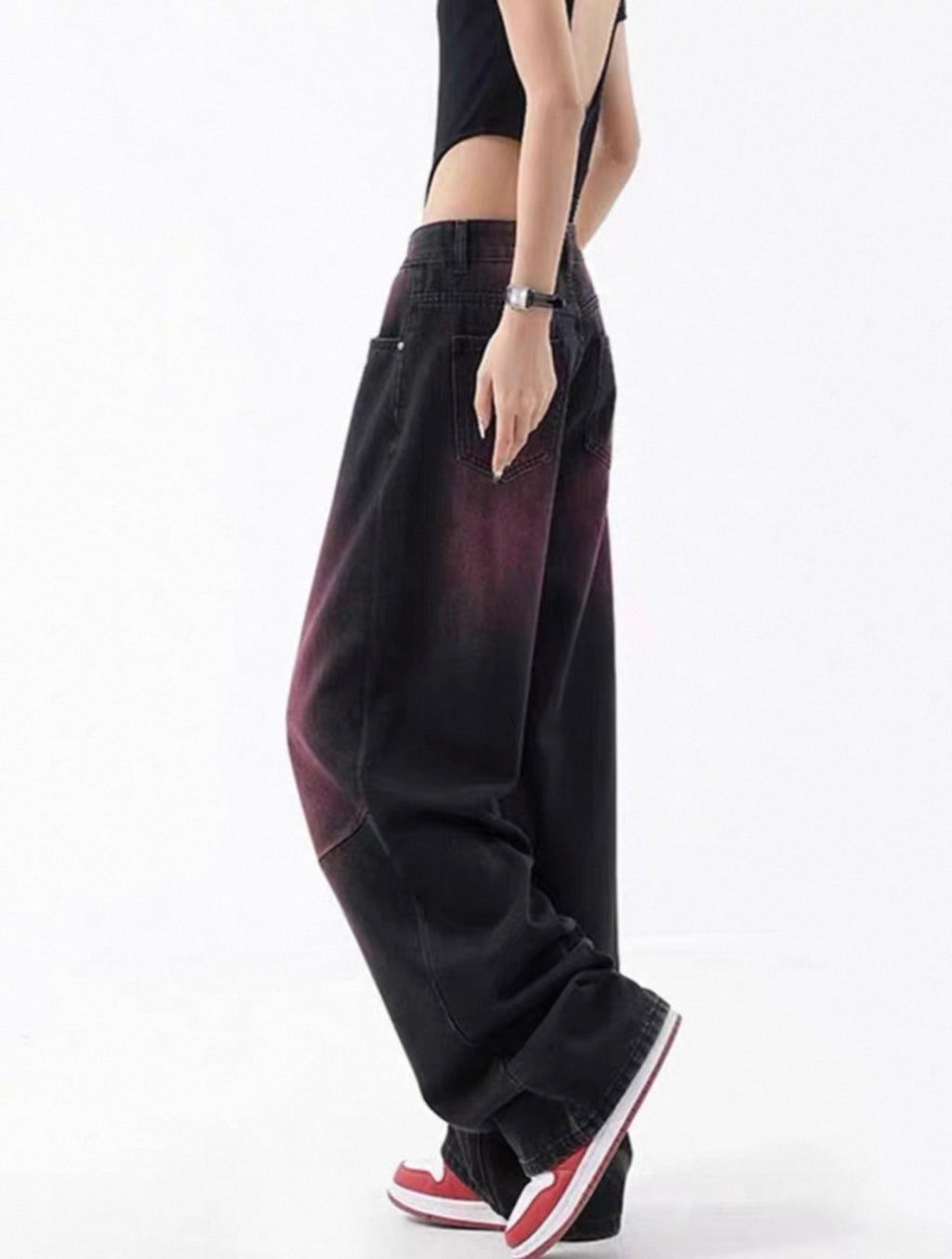 Person wearing wide-leg pants with a gradient effect on a white background