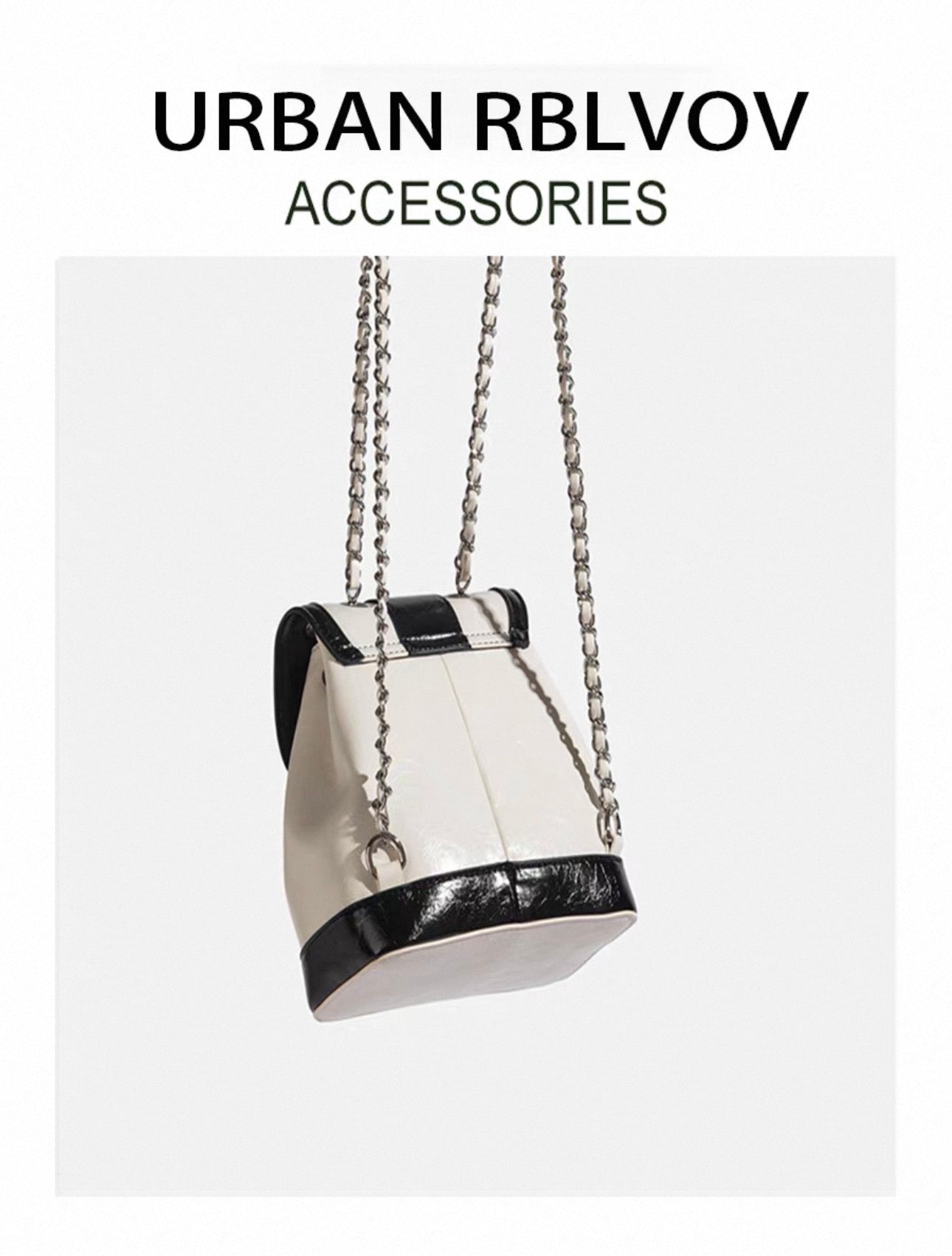 White handbag with black accents and chain strap on a white background, featuring 'Urban RBLVOV' branding.