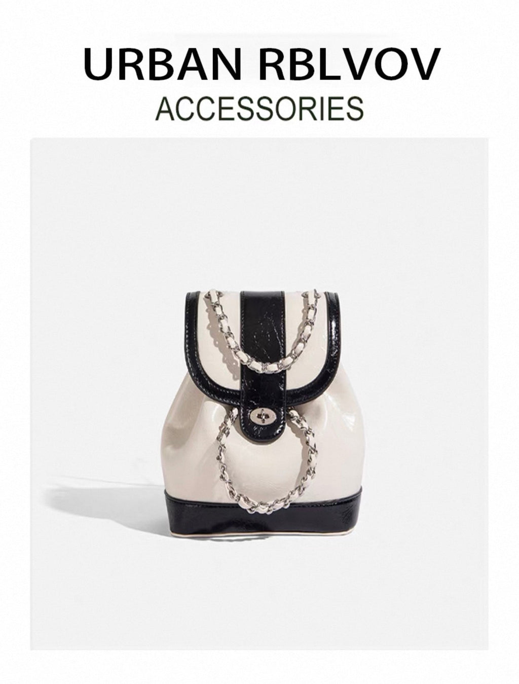 White and black handbag with chain detail on a white background, featuring 'Urban RBLVOV' branding.