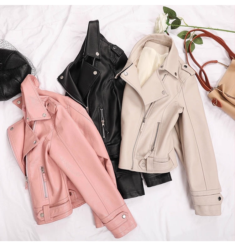 Three leather jackets in pink, black, and beige on a white background.